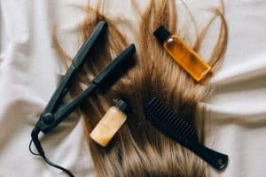 Stylist applying nanoplasty keratin product to client's hair
